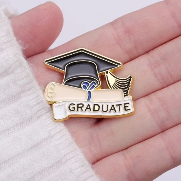 cn-11134207-7r98o-ls6exufp4zq520.webp Graduation Enamel Bagpack Pin