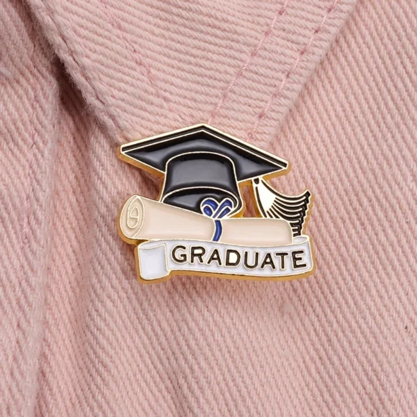 cn-11134207-7r98o-ls6exufp6eal2e.webp Graduation Enamel Bagpack Pin