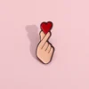 sg-11134201-7qvec-lfvyug761rb590.webp Cute Finger Heart Enamel Bagpack Pin