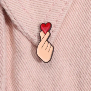 sg-11134201-7qvf3-lfw68m5y1h1d7c.webp Cute Finger Heart Enamel Bagpack Pin
